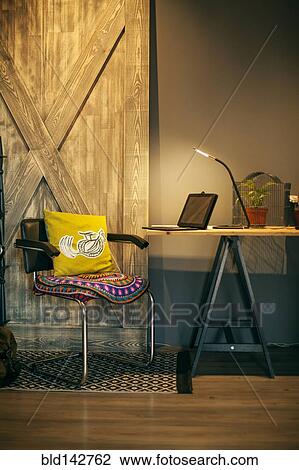 Stock Image - Chair and tablet computer in home office. Fotosearch