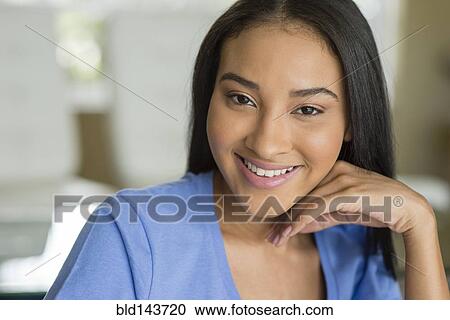 Stock Image - Close up of Black woman smiling. Fotosearch