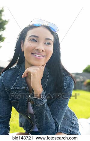 Stock Image - Close up of Black woman smiling. Fotosearch