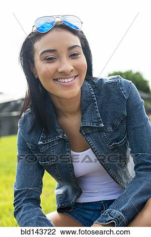 Stock Image - Close up of Black woman smiling. Fotosearch