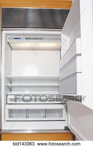 Stock Image - Close up of empty open refrigerator. Fotosearch