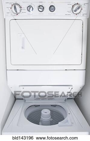 Close up of empty stacking washing machine and dryer View Large Photo Image Stock Photograph - Close up of empty stacking washing machine and dryer. Fotosearch