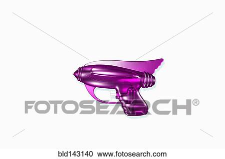 Stock Image - Close up of futuristic purple laser gun. Fotosearch