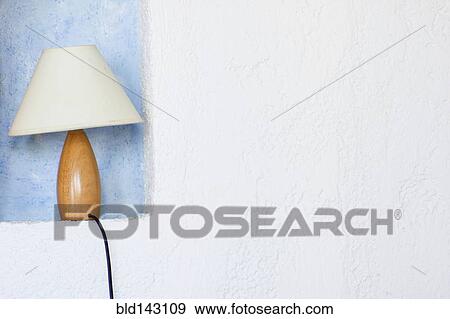Close up of lamp in wall sconce View Large Photo Image Stock Photo - Close up of lamp in wall sconce. Fotosearch