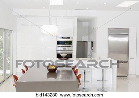 Stock Image - Counters and cabinets in modern kitchen. Fotosearch