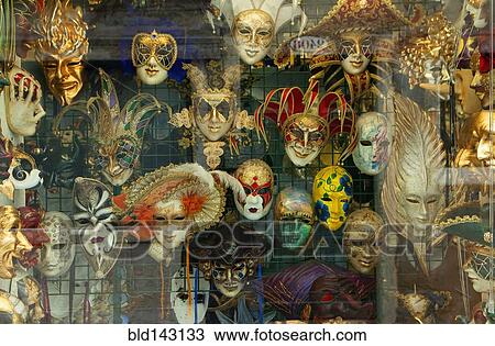 Decorative masks hanging in store window View Large Photo Image Stock Image - Decorative masks hanging in store window. Fotosearch