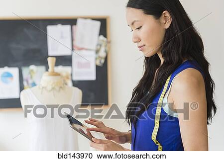 Designer using digital tablet View Large Photo Image Stock Image - Designer using digital tablet. Fotosearch