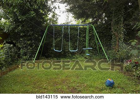 Empty swing set in backyard View Large Photo Image Stock Photography - Empty swing set in backyard. Fotosearch