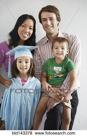 Family with graduating daughter smiling together View Large Photo Image Stock Photo - Family with graduating daughter smiling together. Fotosearch