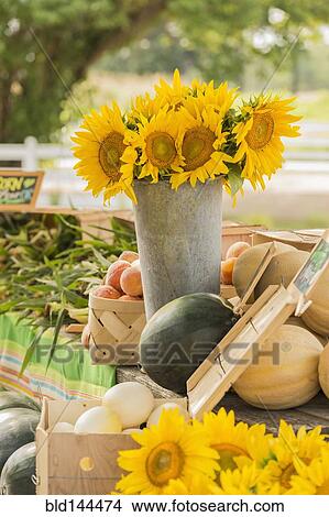 Picture - Flowers and produce at farmers market. Fotosearch