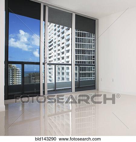 Glass doors and balcony of empty modern apartment View Large Photo Image Stock Image - Glass doors and balcony of empty modern apartment. Fotosearch