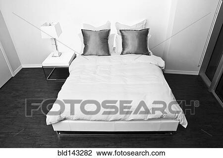 High angle view of bed and night table in modern bedroom View Large Photo Image Stock Image - High angle view of bed and night table in modern bedroom. Fotosearch