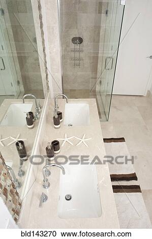 High angle view of sinks and shower in modern bathroom View Large Photo Image Stock Image - High angle view of sinks and shower in modern bathroom. Fotosearch