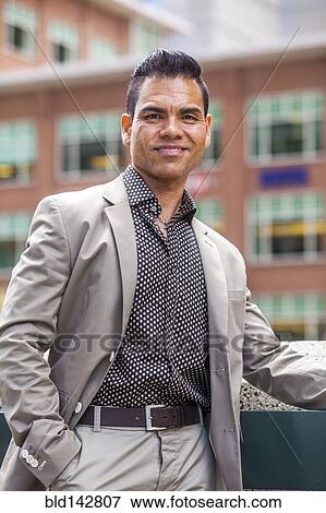 Hispanic businessman smiling outdoors View Large Photo Image Stock Photo - Hispanic businessman smiling outdoors. Fotosearch
