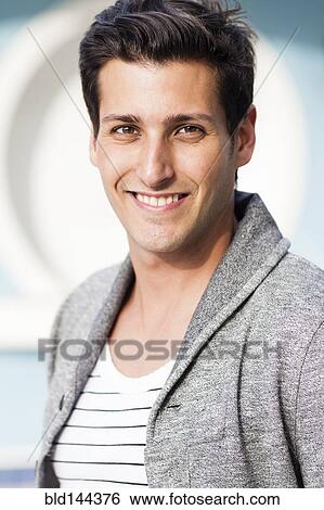 Stock Photograph - Hispanic man smiling. Fotosearch