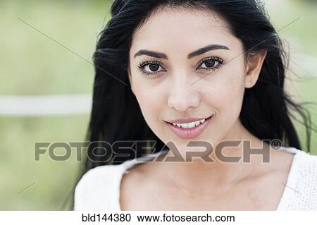 Hispanic woman smiling outdoors View Large Photo Image Stock Image - Hispanic woman smiling outdoors. Fotosearch