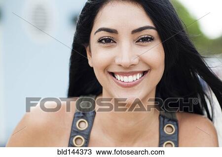 Stock Image - Hispanic woman smiling. Fotosearch