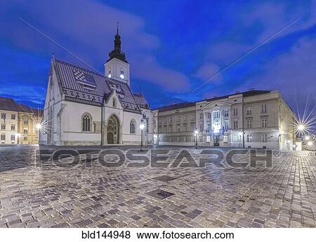 Stock Photo - Illuminated church and town square buildings, Zagreb, Zagreb, Croatia. Fotosearch