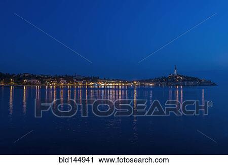 Illuminated coastal city reflected in still water, Rovinj, Istria, Croatia View Large Photo Image Stock Image - Illuminated coastal city reflected in still water, Rovinj, Istria, Croatia. Fotosearch