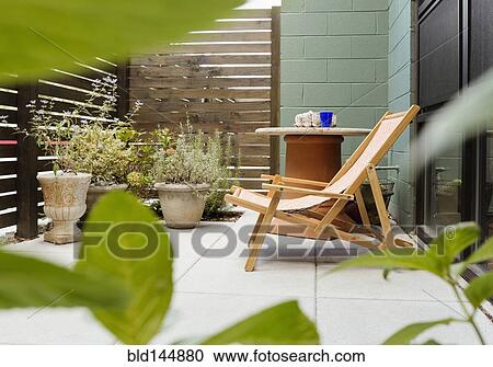 Landscaping and patio of modern condo building View Large Photo Image Stock Image - Landscaping and patio of modern condo building. Fotosearch