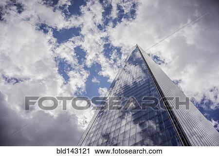 Low angle view of clouds reflected in skyscraper View Large Photo Image Stock Image - Low angle view of clouds reflected in skyscraper. Fotosearch