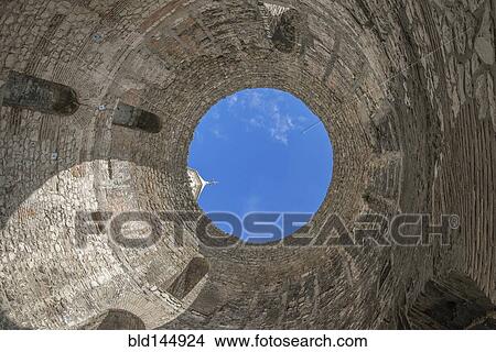 Low angle view of skylight in stone dome View Large Photo Image Picture - Low angle view of skylight in stone dome. Fotosearch