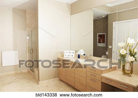 Mirror, sink and shower in modern bathroom View Large Photo Image Stock Photo - Mirror, sink and shower in modern bathroom. Fotosearch