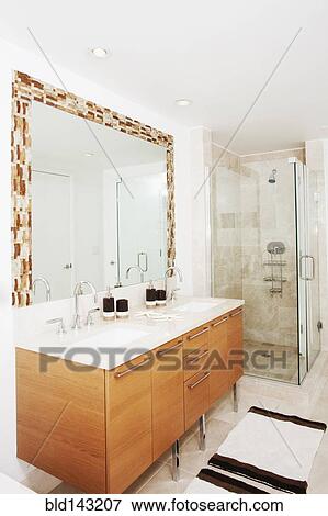 Stock Photo - Mirror, sinks and shower in modern bathroom. Fotosearch