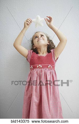 Stock Photography - Mixed race girl admiring star. Fotosearch