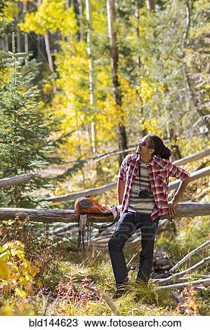 Mixed race man hiking in forest View Large Photo Image Stock Image - Mixed race man hiking in forest. Fotosearch