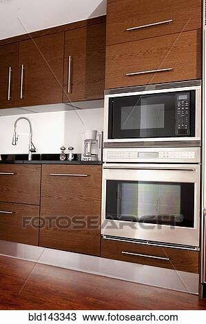 Oven, microwave and sink in modern kitchen View Large Photo Image Stock Image - Oven, microwave and sink in modern kitchen. Fotosearch