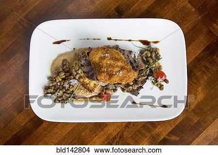 Plate of meat and legumes View Large Photo Image Picture - Plate of meat and legumes. Fotosearch