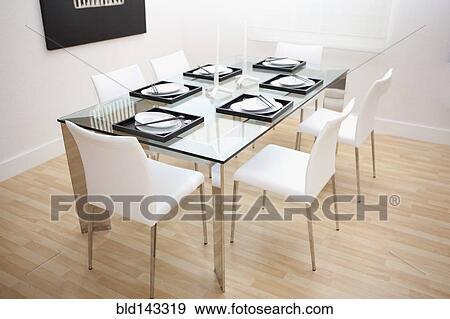 Set table and chairs in modern dining room View Large Photo Image Stock Photo - Set table and chairs in modern dining room. Fotosearch