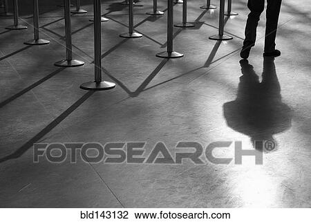Shadow of man and roped-off barriers View Large Photo Image Stock Image - Shadow of man and roped-off barriers. Fotosearch