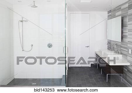 Stock Image - Shower, sinks and mirror in modern bathroom. Fotosearch