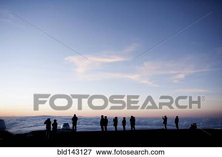 Silhouette of tourists admiring view from mountaintop, Kilauea, Hawaii, United States View Large Photo Image Stock Photo - Silhouette of tourists admiring view from mountaintop, Kilauea, Hawaii, United States. Fotosearch