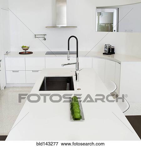 Stock Photo - Sink, counter and stove in modern kitchen. Fotosearch