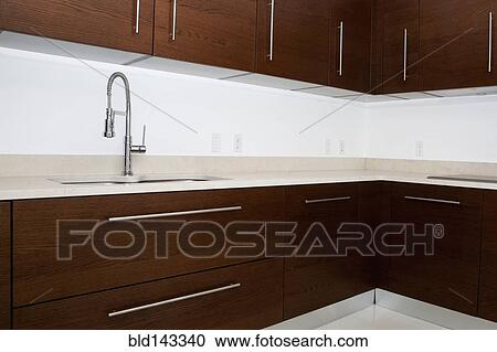 Sink, faucet and countertops in modern kitchen View Large Photo Image Stock Image - Sink, faucet and countertops in modern kitchen. Fotosearch