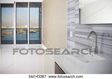 Sink, windows and countertop in modern kitchen View Large Photo Image Stock Photo - Sink, windows and countertop in modern kitchen. Fotosearch