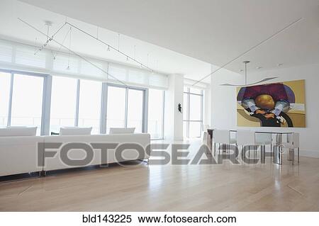 Sofa and dining table in open living space of apartment View Large Photo Image Stock Photography - Sofa and dining table in open living space of apartment. Fotosearch