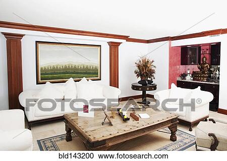 Sofa, coffee table and wall art in living room View Large Photo Image Stock Image - Sofa, coffee table and wall art in living room. Fotosearch