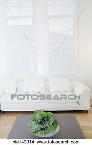 Picture - Sofa, coffee table and windows in modern living room. Fotosearch