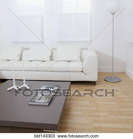 Stock Image - Sofa, coffee table in modern living room. Fotosearch
