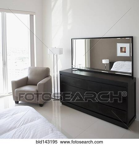 Sofa, dresser and mirror in modern apartment View Large Photo Image Stock Photography - Sofa, dresser and mirror in modern apartment. Fotosearch