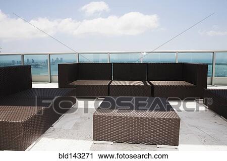 Sofas and coffee table on modern patio View Large Photo Image Stock Image - Sofas and coffee table on modern patio. Fotosearch