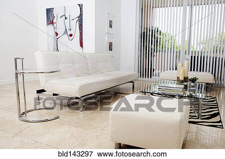 Sofas, ottomans and coffee table in modern living room View Large Photo Image Stock Photo - Sofas, ottomans and coffee table in modern living room. Fotosearch