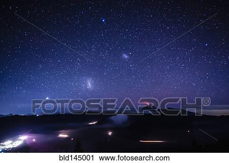 Starry night sky over active volcano View Large Photo Image Stock Image - Starry night sky over active volcano. Fotosearch