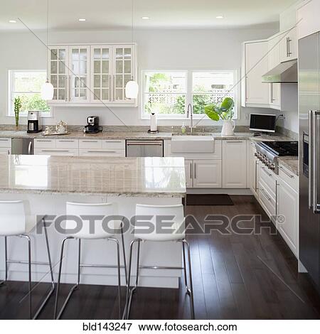 Stools, breakfast bar and counters in modern kitchen View Large Photo Image Stock Photo - Stools, breakfast bar and counters in modern kitchen. Fotosearch