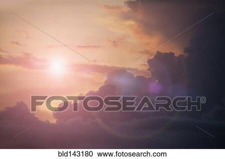 Sunbeams shining in cloudy sky View Large Photo Image Stock Image - Sunbeams shining in cloudy sky. Fotosearch