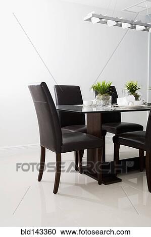 Table and chairs in modern dining room View Large Photo Image Stock Image - Table and chairs in modern dining room. Fotosearch